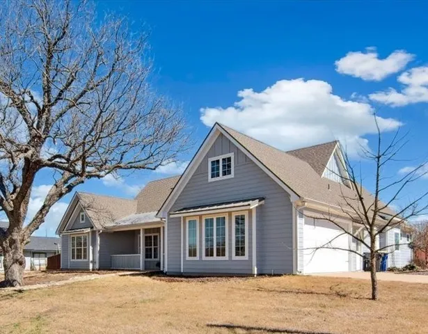 a living room with furniture flat screen tv and a fireplace