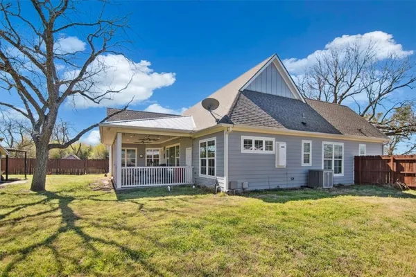 a living room with furniture fireplace and a flat screen tv