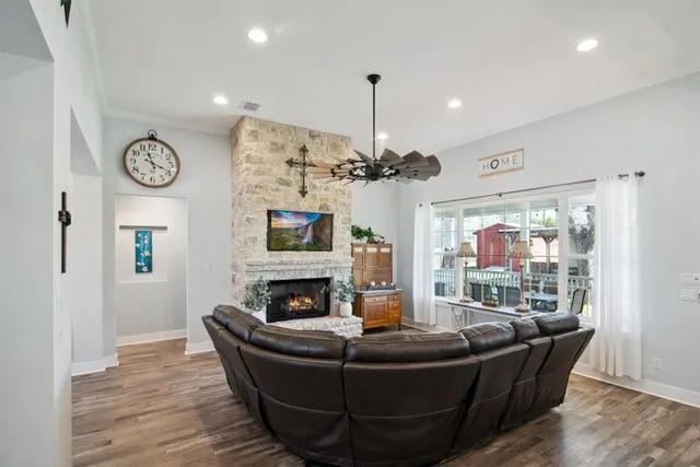 a view of a dining room with furniture wooden floor and chandelier