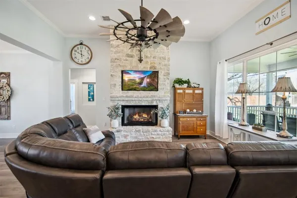 a kitchen with a sink a kitchen island and stainless steel appliances