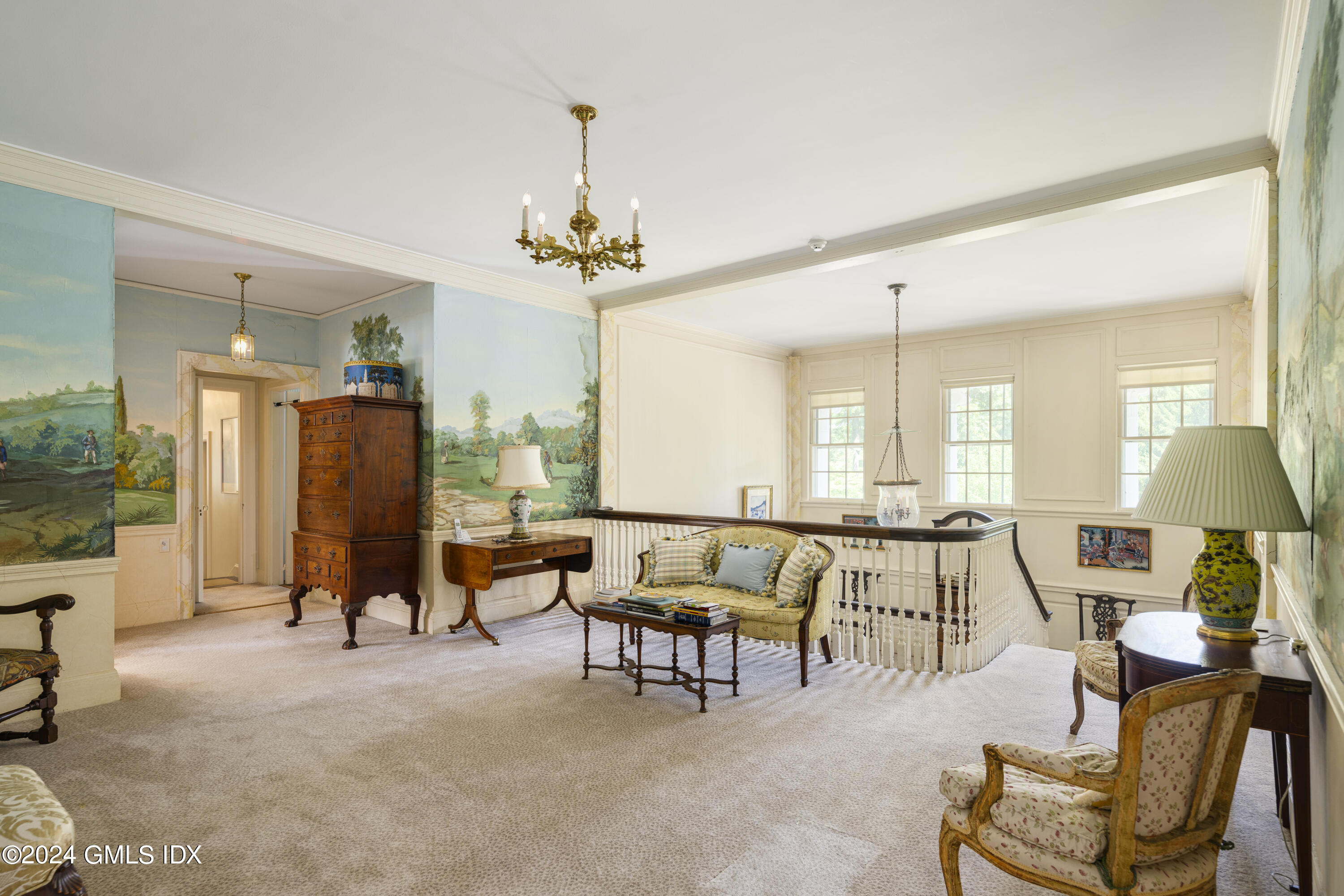 10 Cliffdale Road Greenwich, CT 06831 - Photo 15 of 31 a living room with furniture and a chandelier