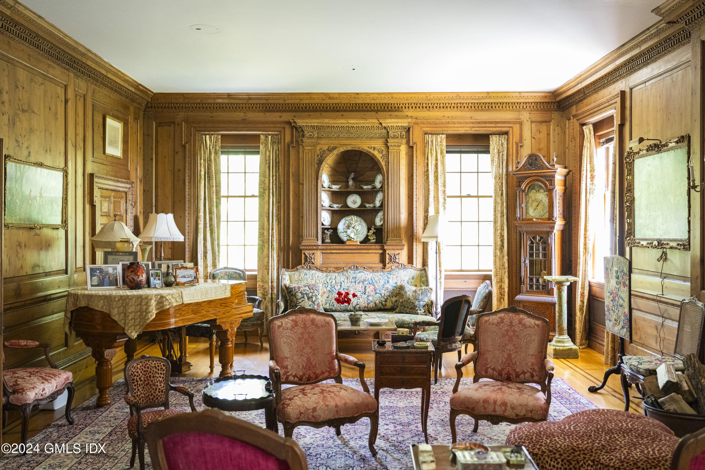 10 Cliffdale Road Greenwich, CT 06831 - Photo 9 of 31 a living room with furniture and large windows
