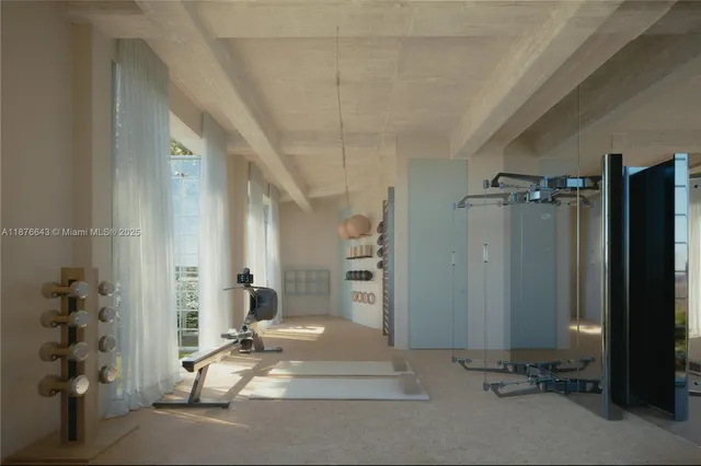 a view of a hallway with closet and a window