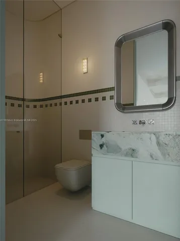 a bathroom with a sink and mirror