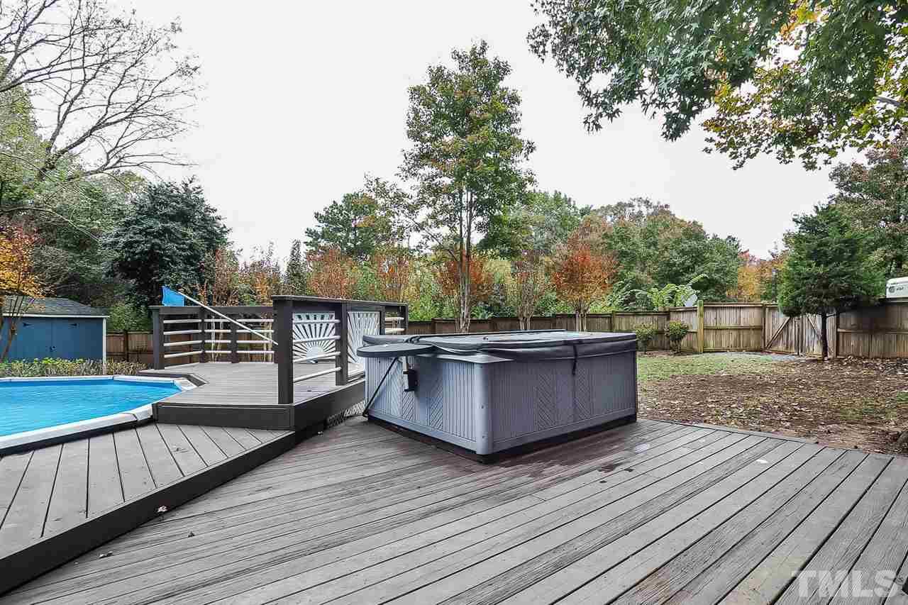 4009 Pleasant Grove Church Road Raleigh, NC 27613 - Photo 13 of 15 a view of a wooden deck and a backyard