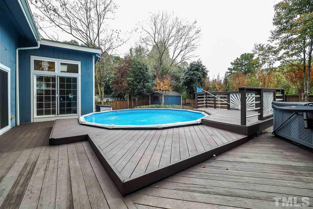 4009 Pleasant Grove Church Road Raleigh, NC 27613 - Photo 14 of 15 a view of a wooden deck with a yard