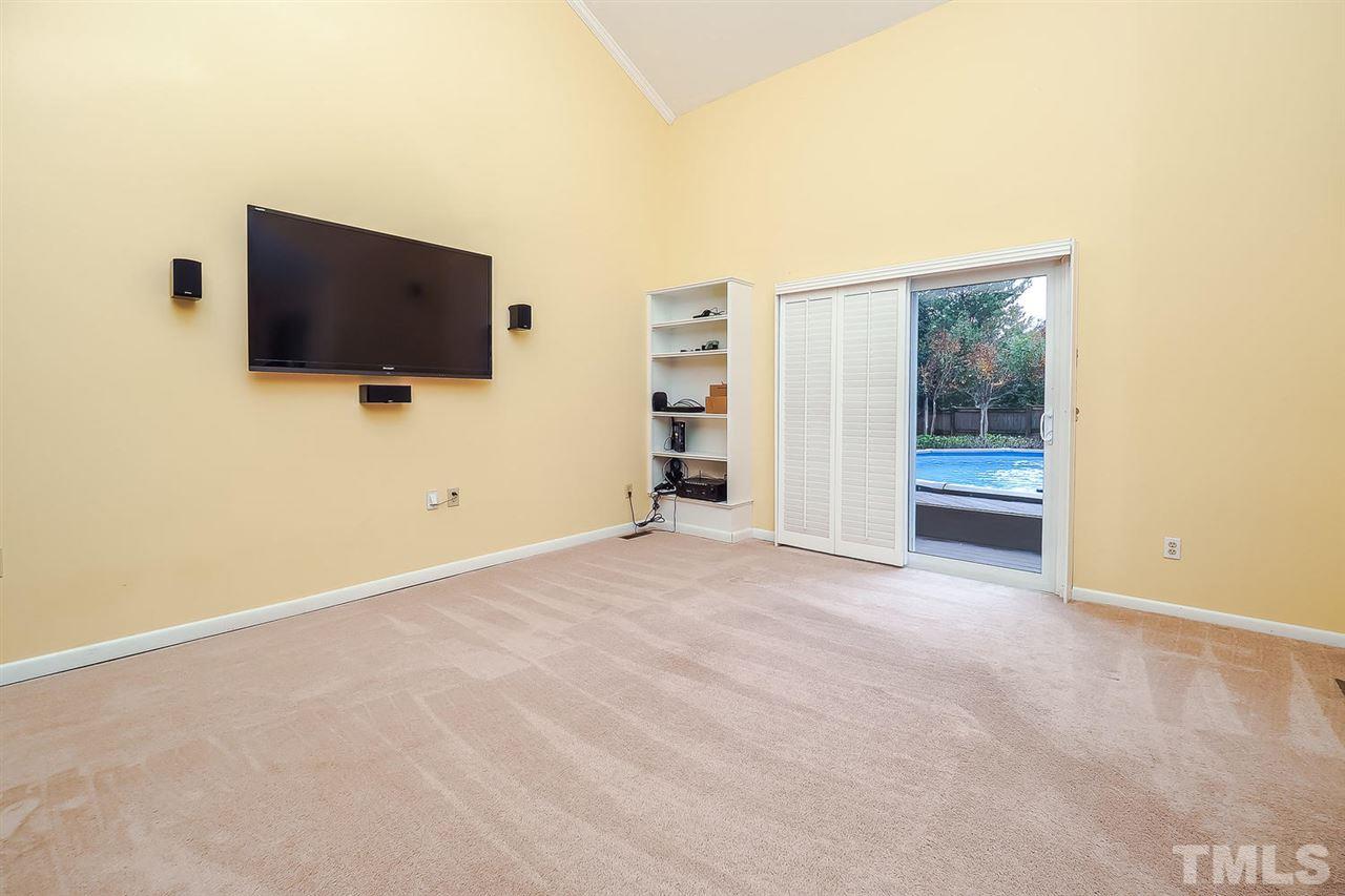 4009 Pleasant Grove Church Road Raleigh, NC 27613 - Photo 3 of 15 a view of a livingroom with a flat screen tv