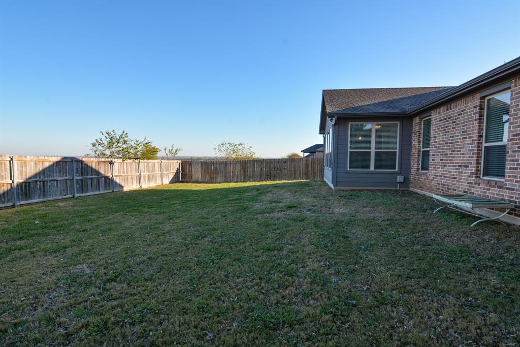 601 Mathew Street Grandview, TX 76050 - Photo 35 of 40 a house view with a garden space