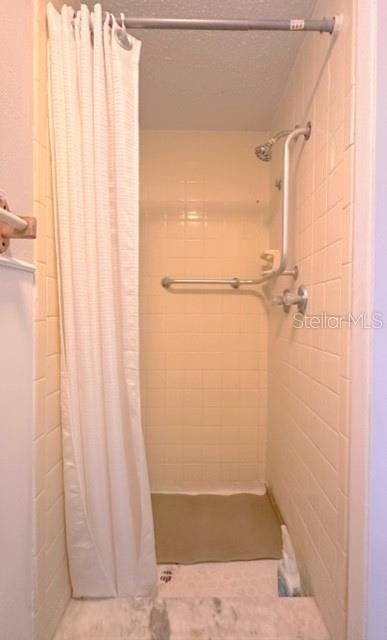 7924 Halsey Drive Port Richey, FL 34668 - Photo 13 of 26 a bathroom with a shower