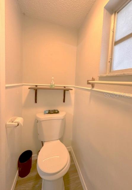 7924 Halsey Drive Port Richey, FL 34668 - Photo 14 of 26 a bathroom with a toilet and a vanity