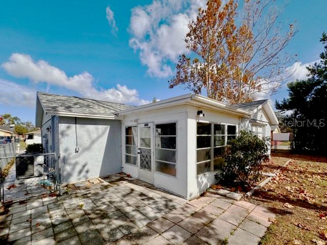 7924 Halsey Drive Port Richey, FL 34668 - Photo 19 of 26 a front view of a house with garden