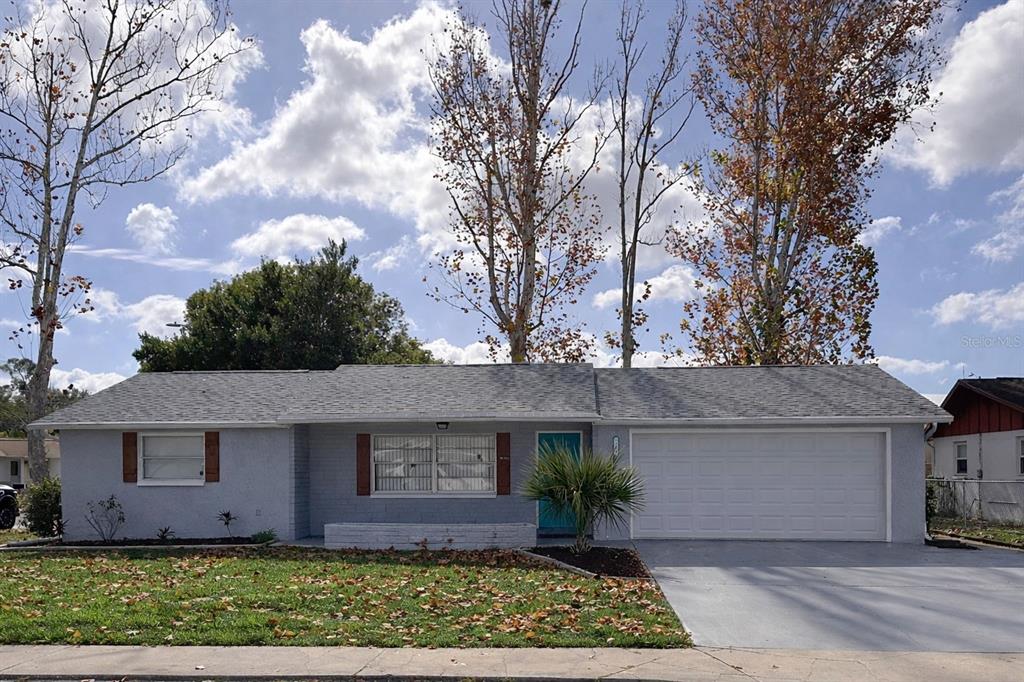 7924 Halsey Drive Port Richey, FL 34668 - Photo 26 of 26 front view of a house with a yard