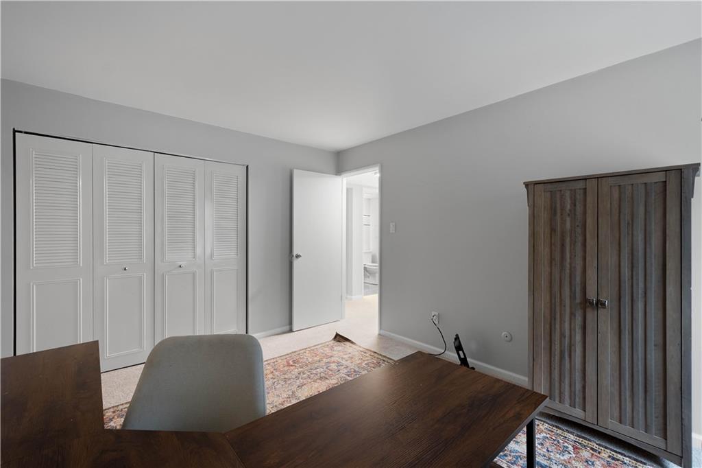 410 Abbeyville Road, Unit D Pittsburgh, PA 15228 - Photo 17 of 19 a bedroom with a bed and wooden floor