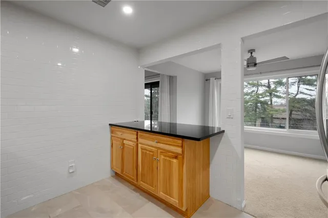 a kitchen with stainless steel appliances granite countertop a sink and a cabinets
