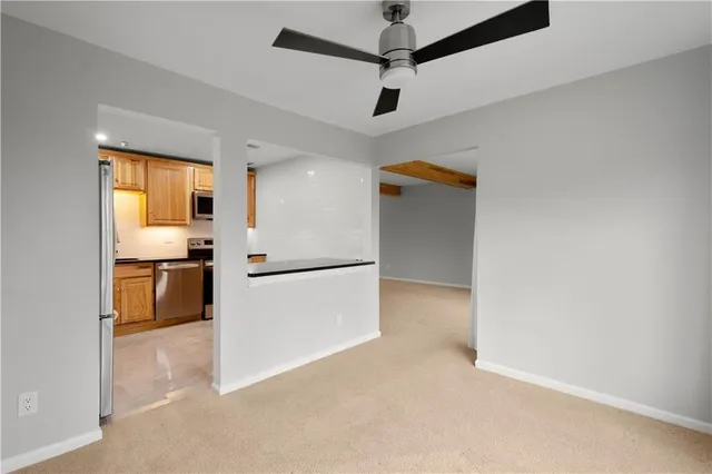 a kitchen with stainless steel appliances a refrigerator and a stove