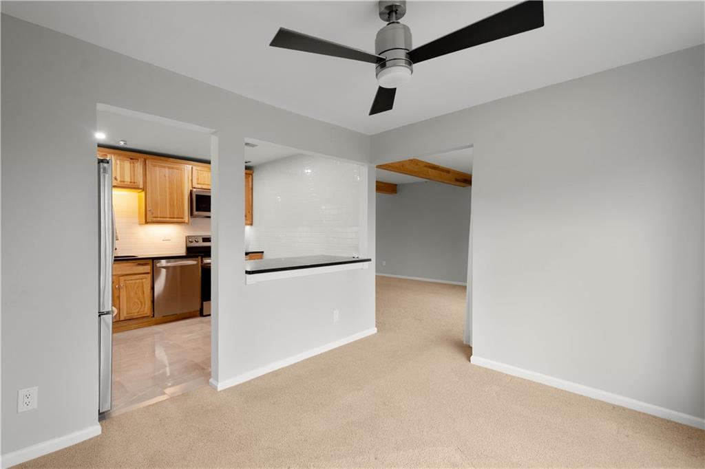 410 Abbeyville Road, Unit D Pittsburgh, PA 15228 - Photo 9 of 19 a kitchen with stainless steel appliances a refrigerator and a stove