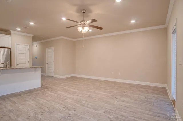 a kitchen with granite countertop a stove and a refrigerator