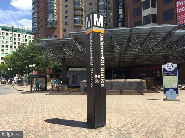 a view of building with a swimming pool
