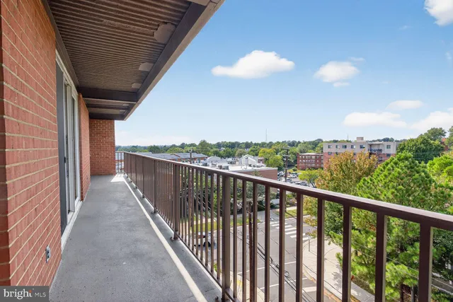 a view of a balcony with wooden floor