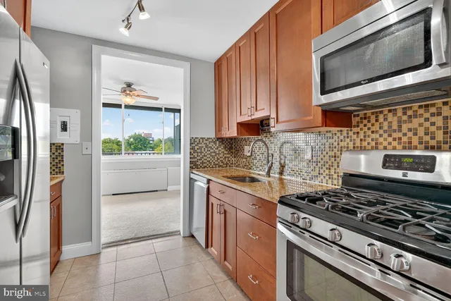 a view of a balcony with wooden floor and fence