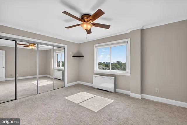 a kitchen with stainless steel appliances granite countertop a stove microwave and refrigerator