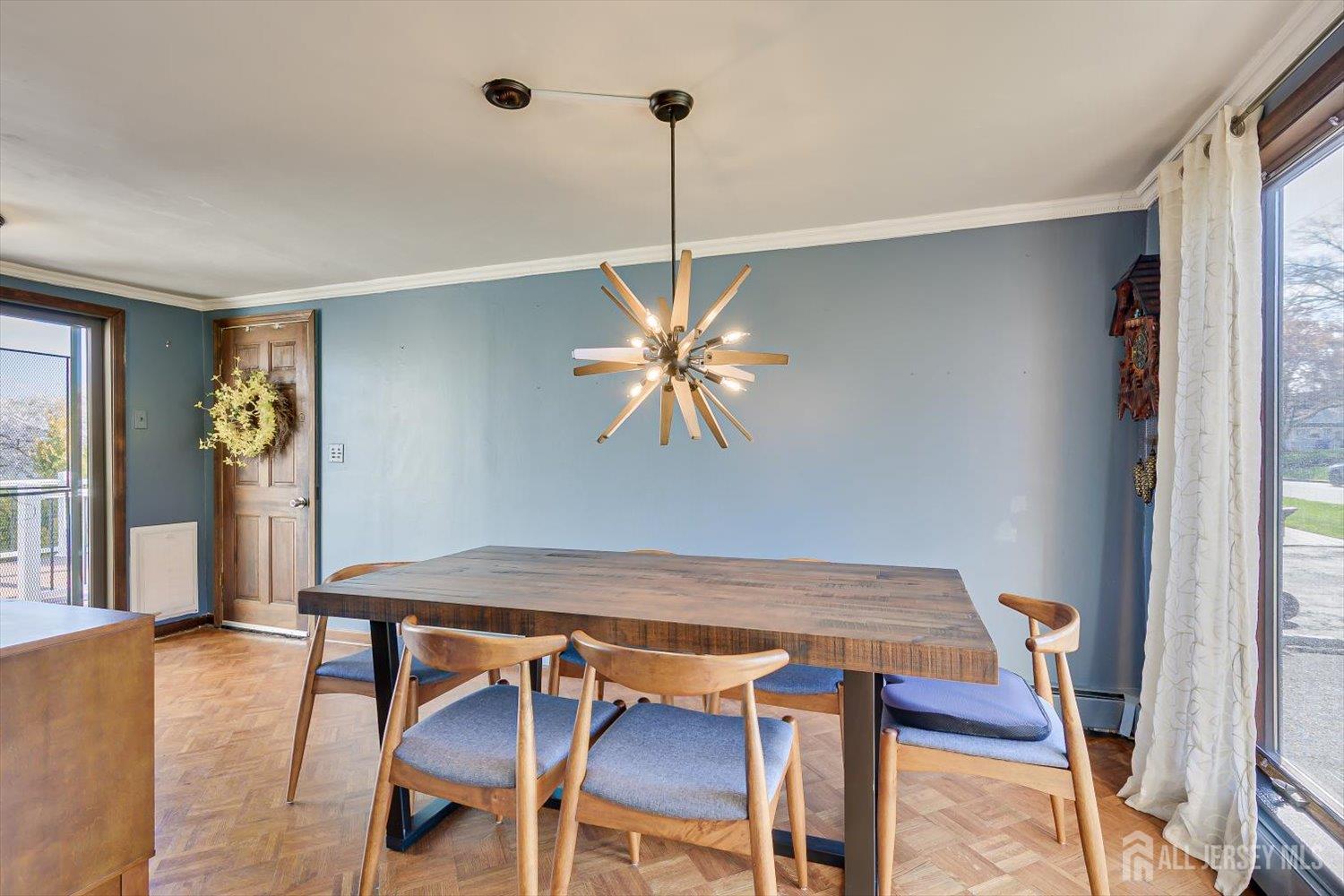 110 Normandy Road Colonia, NJ 07067 - Photo 13 of 57 a view of a dining room with furniture and wooden floor