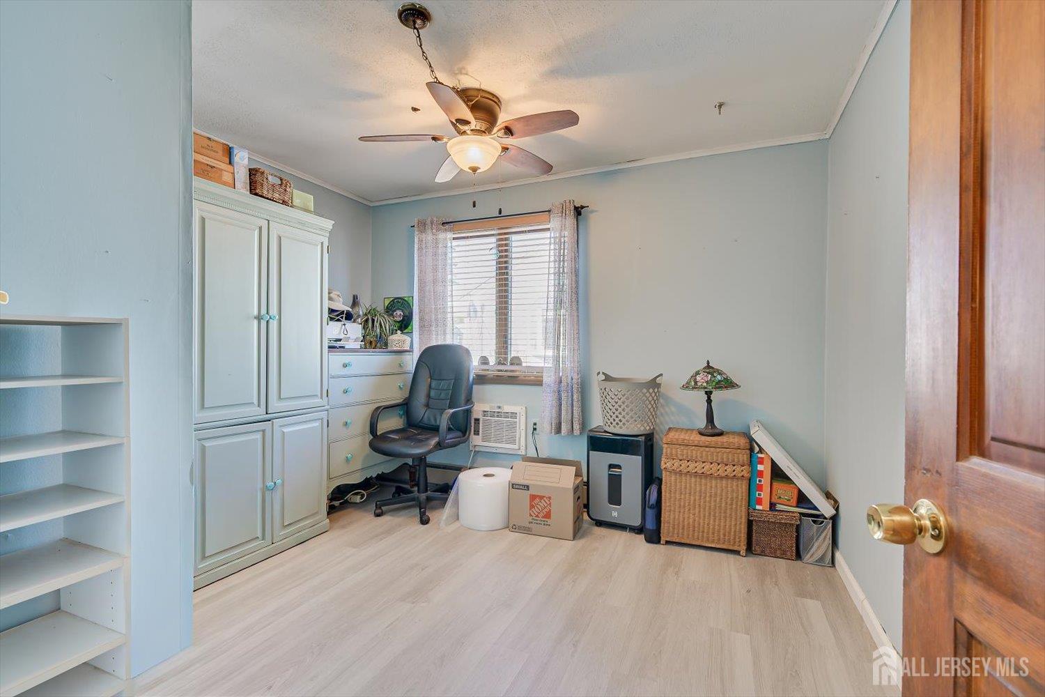 110 Normandy Road Colonia, NJ 07067 - Photo 26 of 57 a view of a workspace with furniture and a window