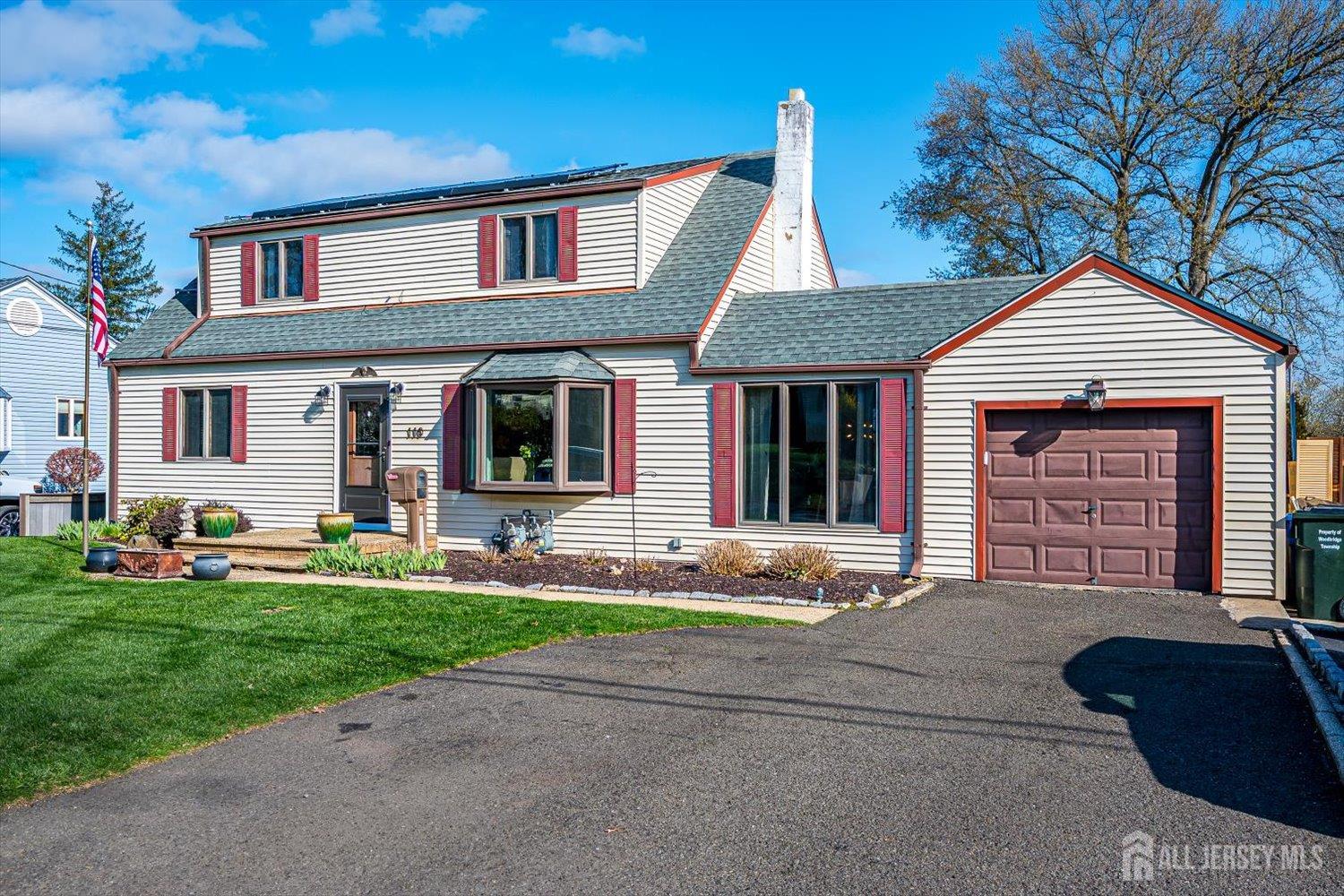 110 Normandy Road Colonia, NJ 07067 - Photo 3 of 57 a front view of a house with a yard and garage