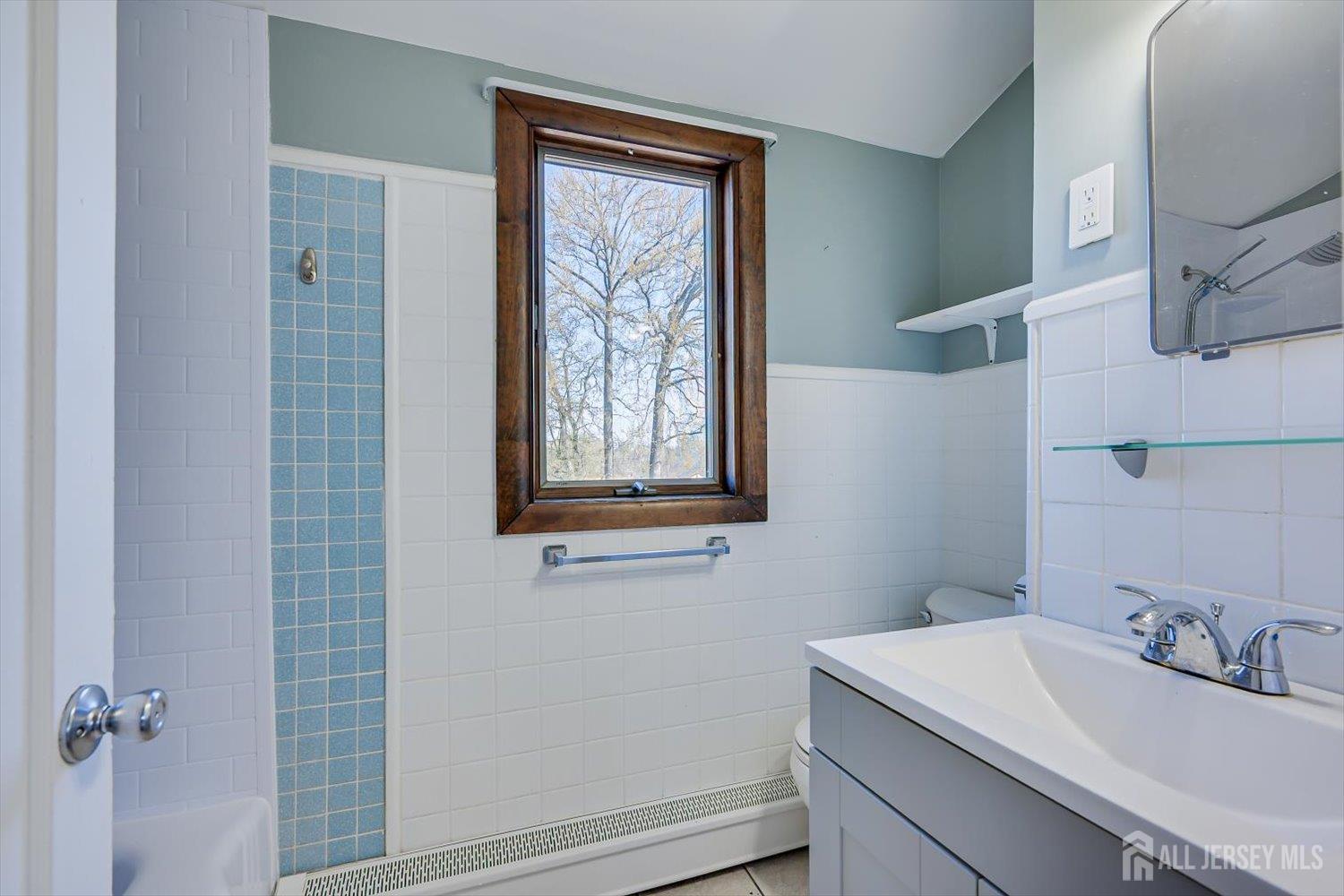 110 Normandy Road Colonia, NJ 07067 - Photo 39 of 57 a bathroom with a sink and a mirror