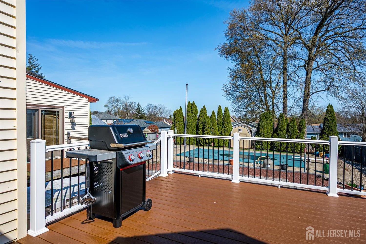 110 Normandy Road Colonia, NJ 07067 - Photo 44 of 57 a view of a balcony with wooden floor and fence