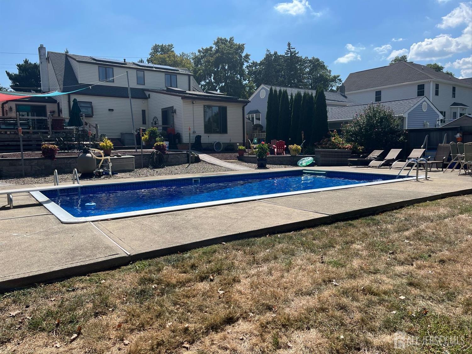 110 Normandy Road Colonia, NJ 07067 - Photo 50 of 57 a view of swimming pool with outdoor seating