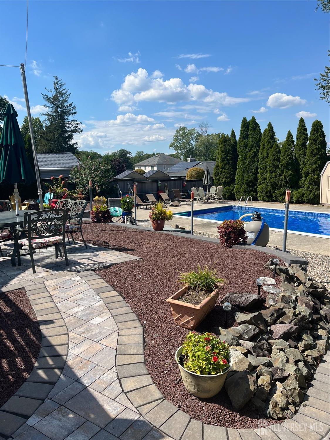 110 Normandy Road Colonia, NJ 07067 - Photo 51 of 57 a view of a backyard with sitting area