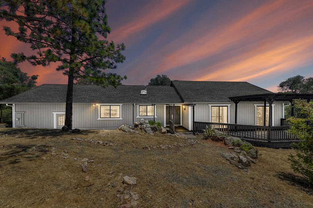 2071 Bogus Point Court Cool, CA 95614 - Photo 12 of 69 a front view of a house with a yard