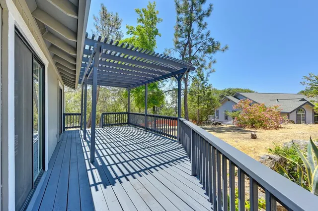 a kitchen with kitchen island a large counter top space appliances and cabinets
