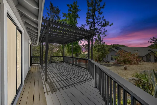 a view of a kitchen with a sink cabinets and wooden floor