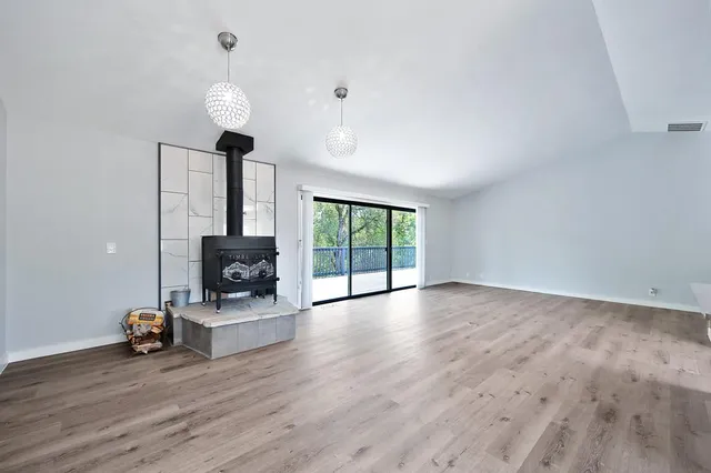 a hall with cabinets and wooden floor