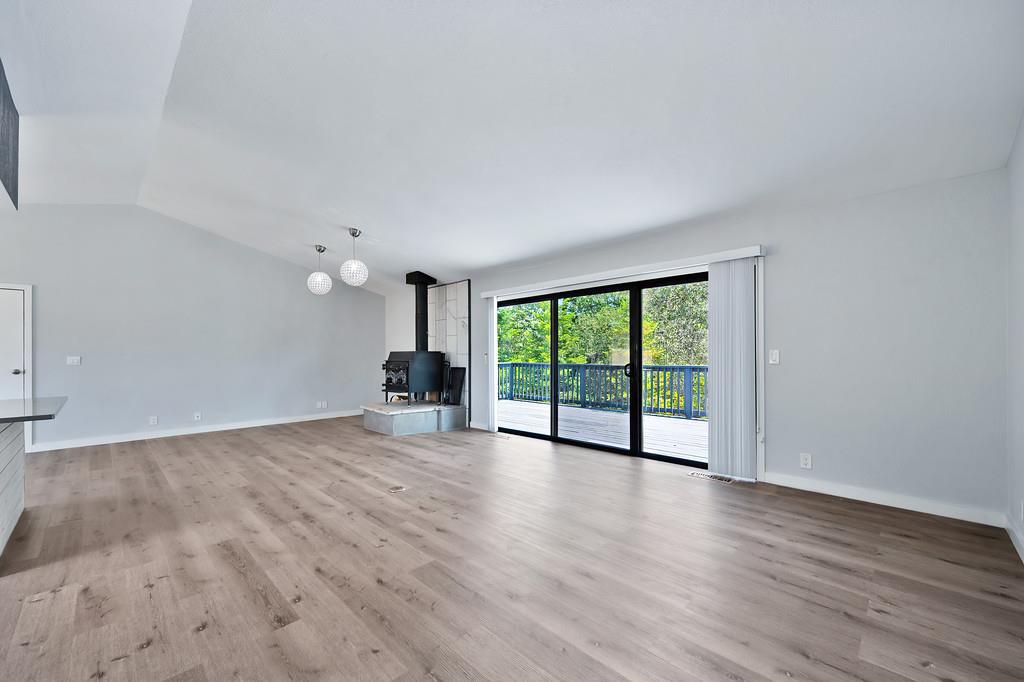 2071 Bogus Point Court Cool, CA 95614 - Photo 24 of 69 a view of an empty room with wooden floor and a window