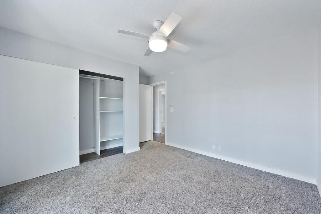 2071 Bogus Point Court Cool, CA 95614 - Photo 35 of 69 an empty room with a ceiling fan and a window