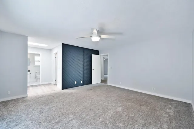 a balcony with wooden floor and fence
