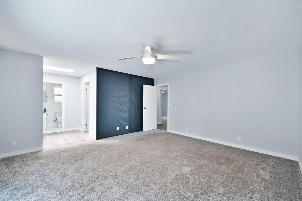 2071 Bogus Point Court Cool, CA 95614 - Photo 39 of 69 an empty room with closet and a ceiling fan