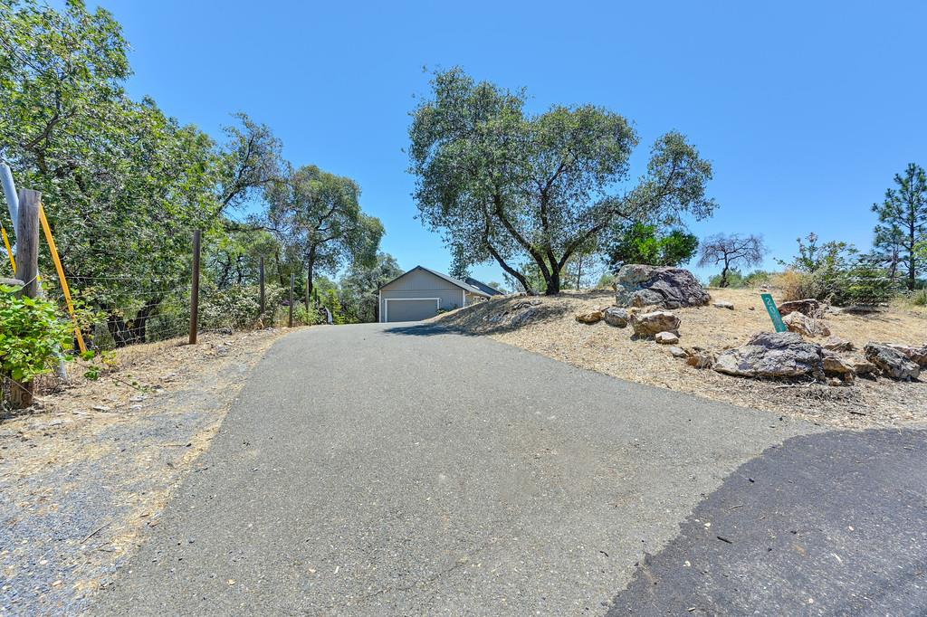 2071 Bogus Point Court Cool, CA 95614 - Photo 4 of 69 a view of a road with a house in the background