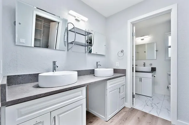 a view of balcony with wooden floor and fence