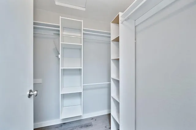 a balcony with wooden floor and outdoor seating