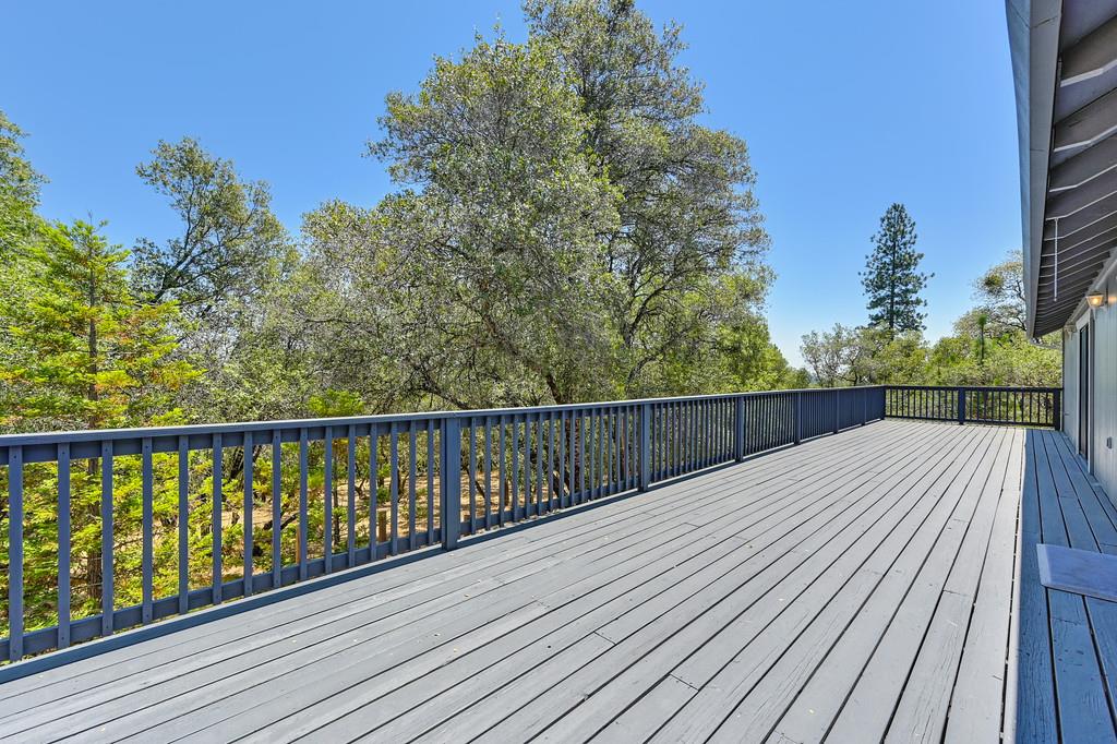 2071 Bogus Point Court Cool, CA 95614 - Photo 46 of 69 a balcony with wooden floor and fence
