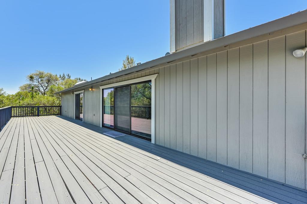 2071 Bogus Point Court Cool, CA 95614 - Photo 47 of 69 a view of backyard with a balcony and wooden floor