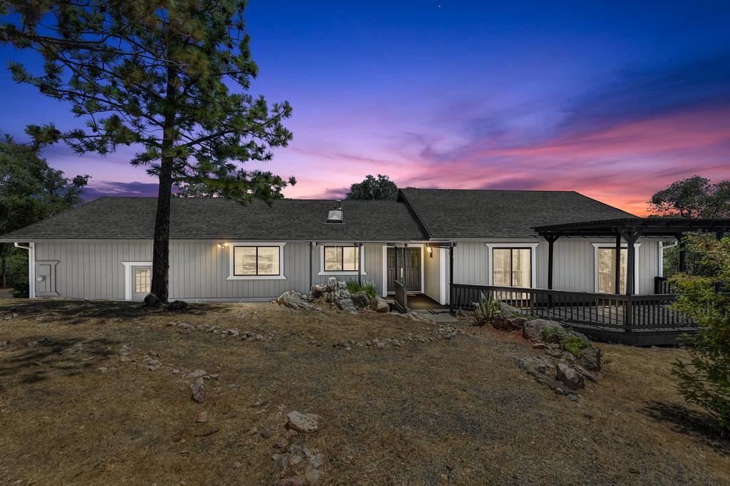 2071 Bogus Point Court Cool, CA 95614 - Photo 8 of 69 a front view of a house with a yard