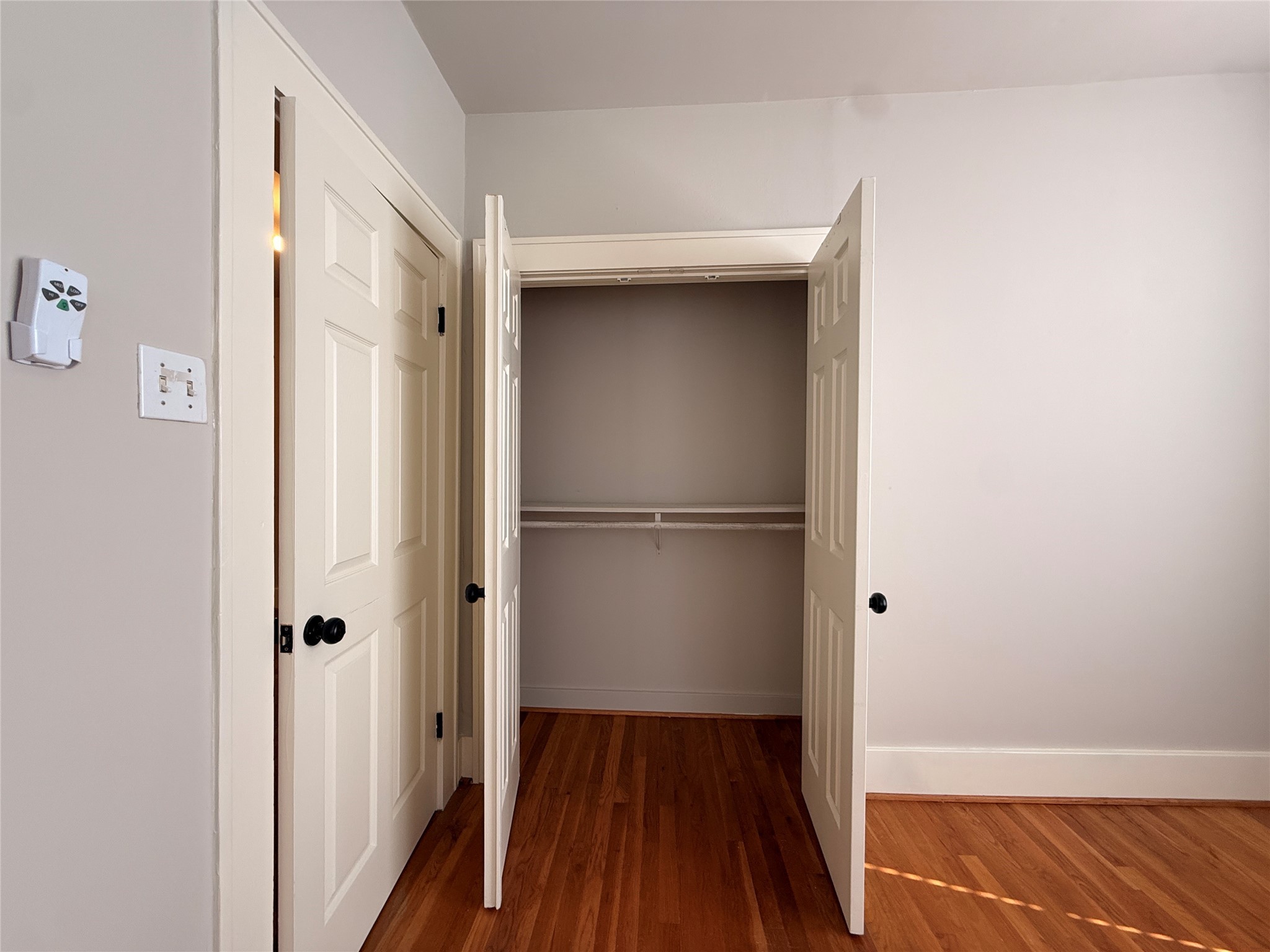 1201 West Gray Street, Unit 3 Houston, TX 77019 - Photo 9 of 14 a view of a room with wooden floor and a hallway