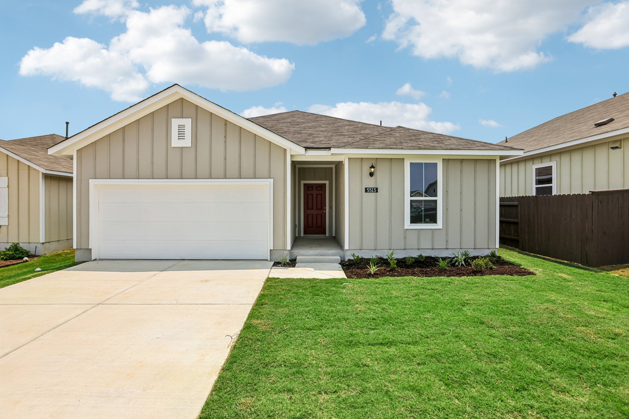 5513 Sacra Cove Austin, TX 78747 - Photo 1 of 37 a front view of house with yard