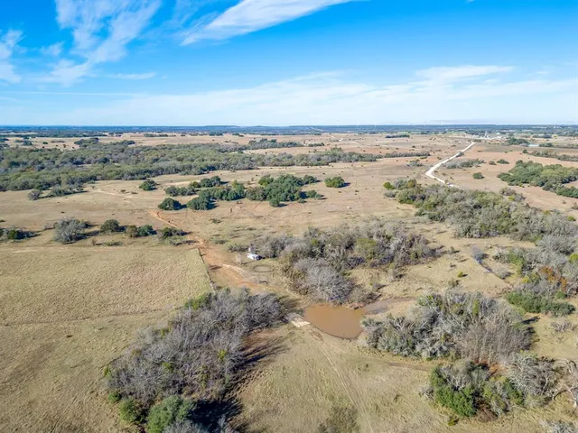 an aerial view of beach and city space
