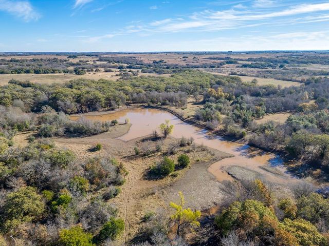 a view of a town with mountains in the background
